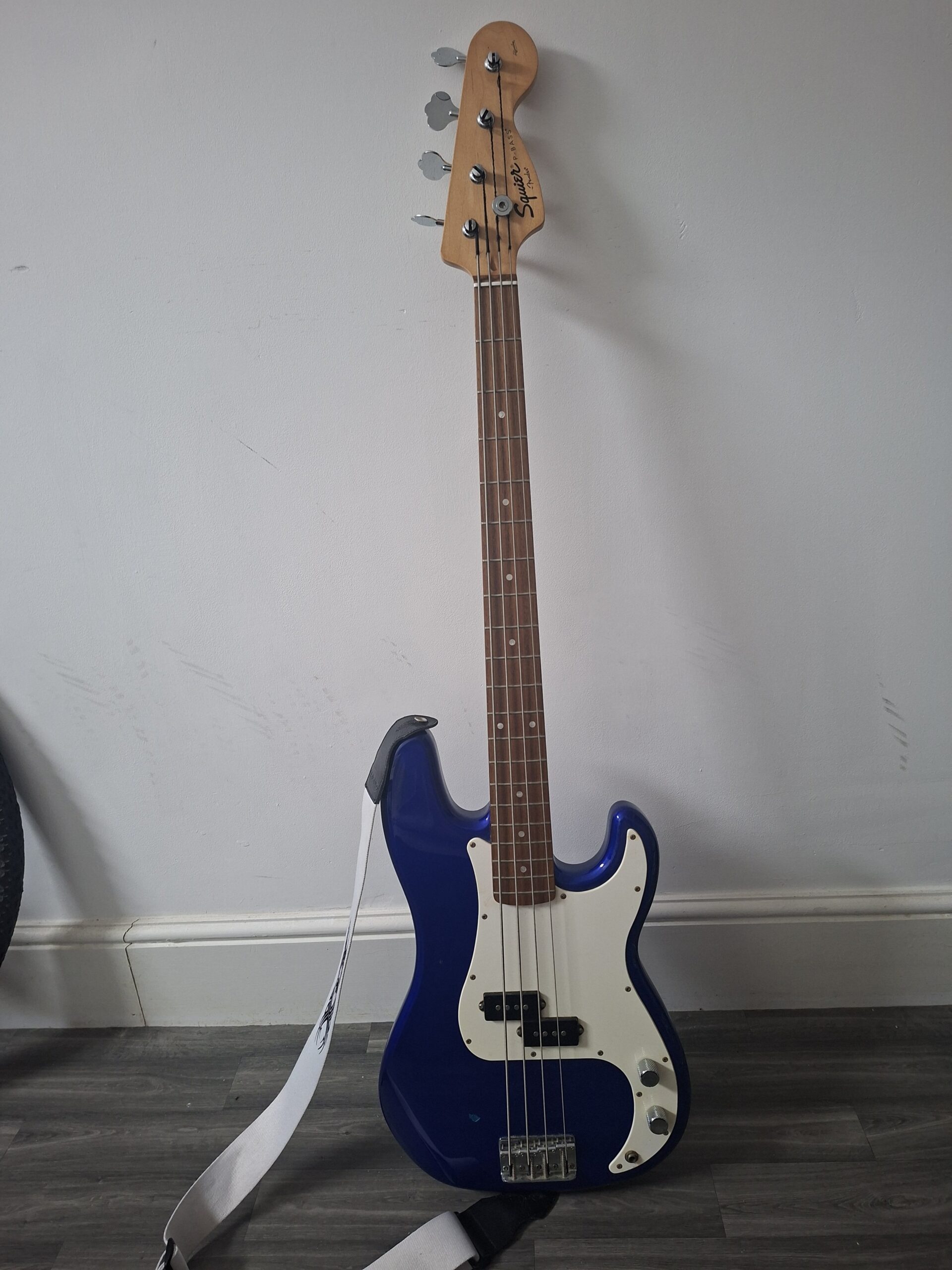 squier bass in metallic blue