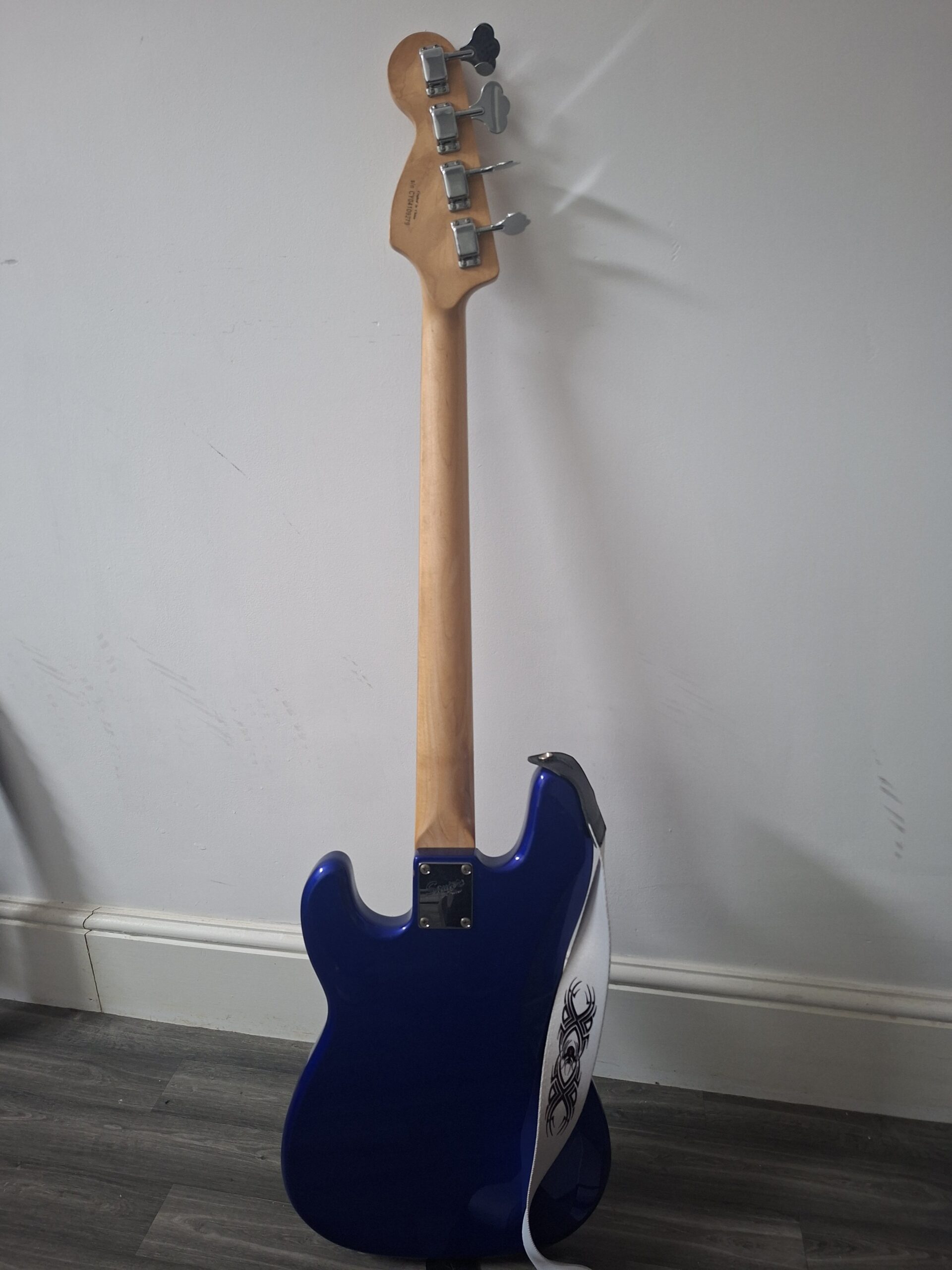 squier bass in metallic blue